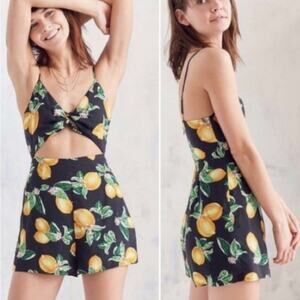 Urban Outfitters Kimichi Blue Lemon print cut- out knotted romper. Size 2